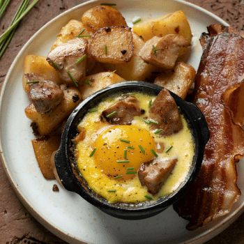 Eggs in a casserole with truffle and crispy bacon